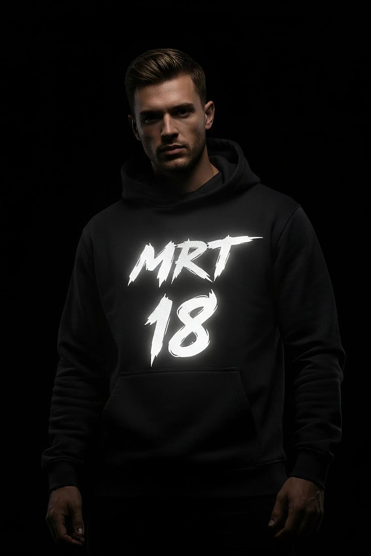 Black custom reflective graphic hoodie on a man, white brushed text "MERT 18"
