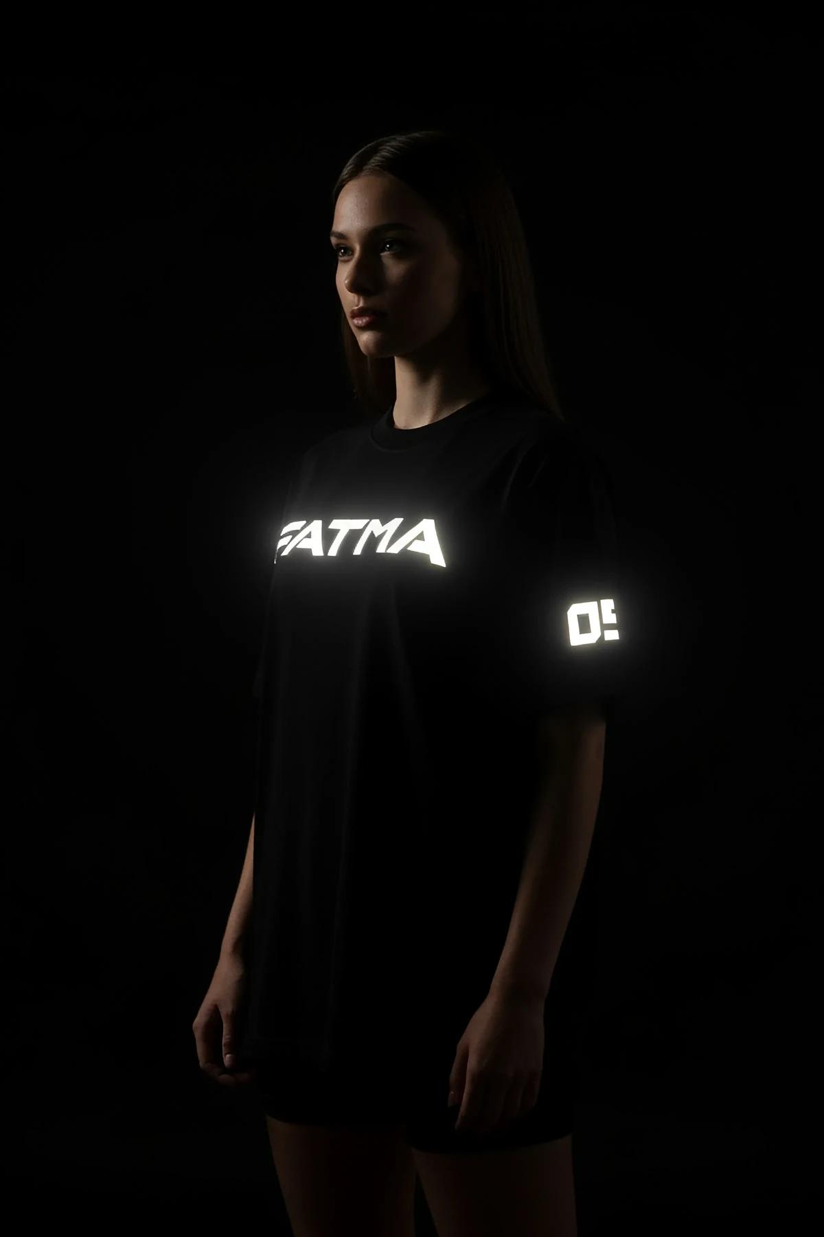 Black Custom Reflective T-Shirt with 'FATMA' graphic for men, model wearing dark sunglasses
