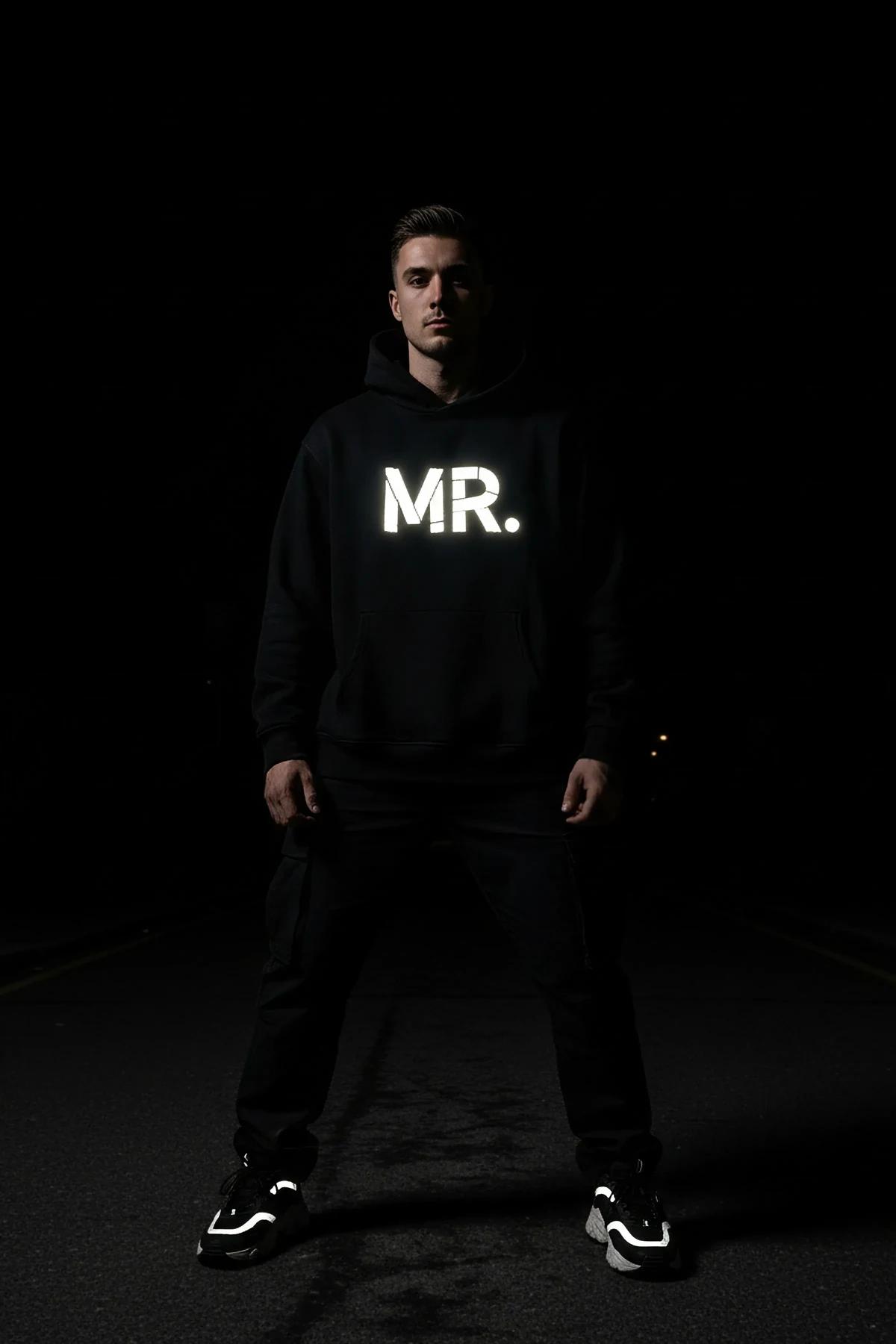 Reflective Mr. Hoodie in black with glow-in-the-dark chest print and matching sneakers for festival outfit