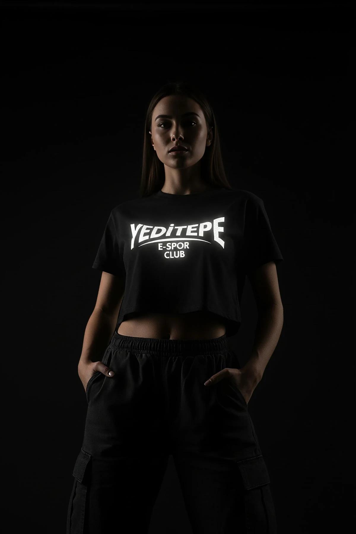 Black reflective crop top and cargo pants outfit showing side view