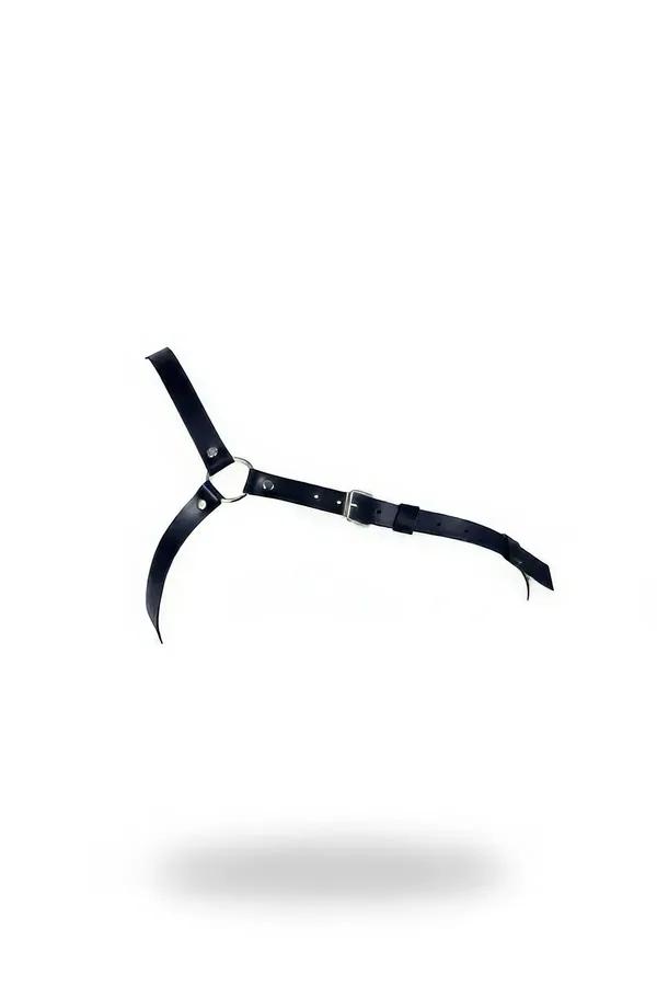 Asymmetric body harness in black faux leather with a single shoulder strap and silver metal O-ring buckle configuration
