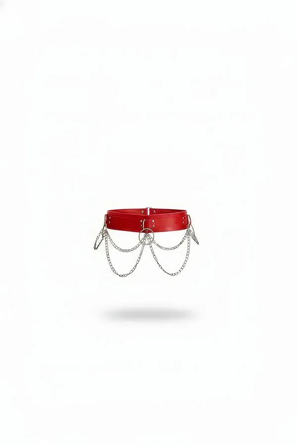 red faux leather waist belt with layered silver draped chains and central O-ring, wide band with stud rivets