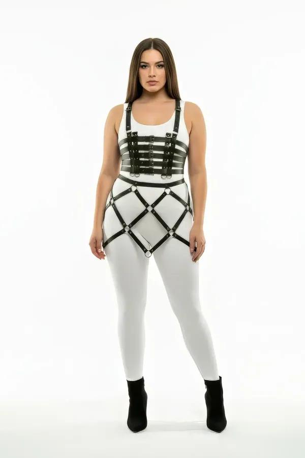 black faux leather cage body harness skirt with five underbust straps and silver o-ring cage skirt worn over white bodysuit a