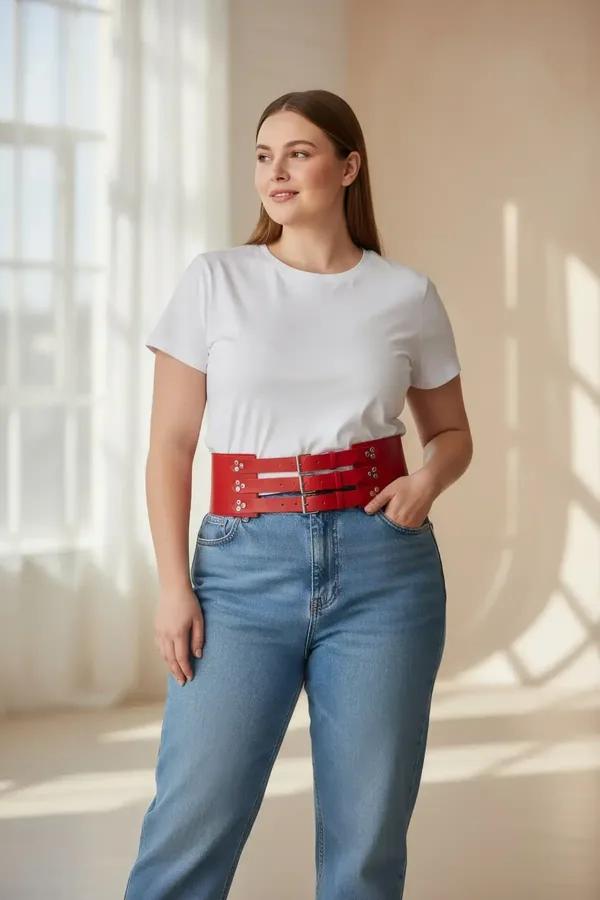red faux leather wide waist cinch harness belt with three silver double-bar buckle straps on plus-size model