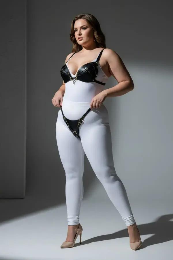 black faux leather studded bra and thong harness set with gold-tone stud trim and center O-ring detail