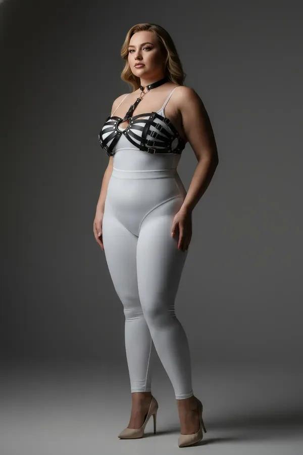 black faux leather caged chest harness with high choker collar and silver O-ring worn over white crop top