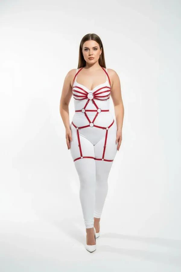red full body caged harness with white O-ring details and adjustable thigh straps worn by plus-size model