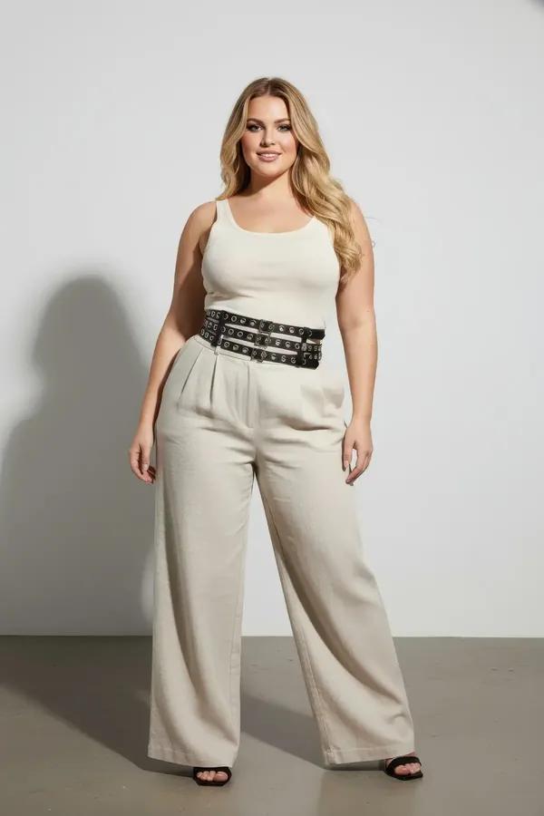 black vegan leather triple-strap eyelet waist cinch harness belt with silver grommets worn over white tank top