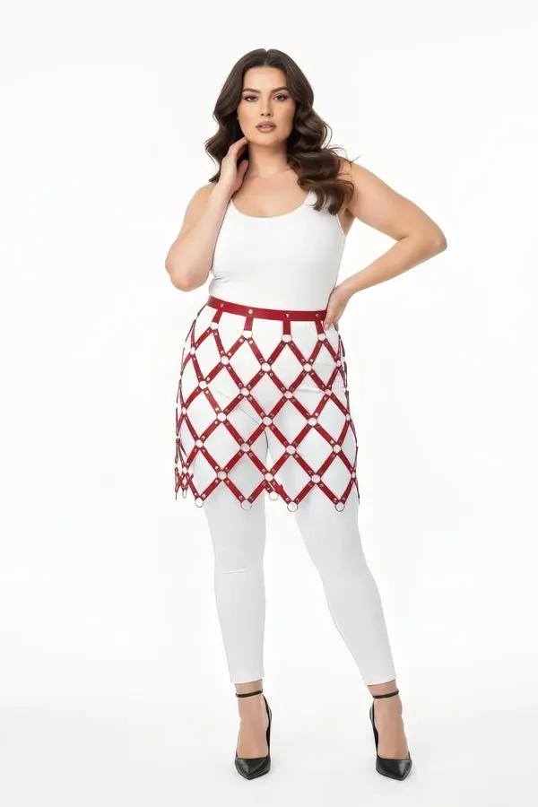 burgundy faux leather harness skirt with silver O-ring diamond grid overlay worn over white leggings