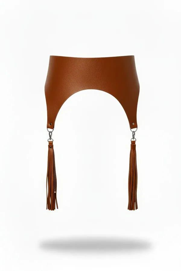 tan faux leather wide waist harness with arched cut-out and two long swinging tassel drops on silver D-ring clips