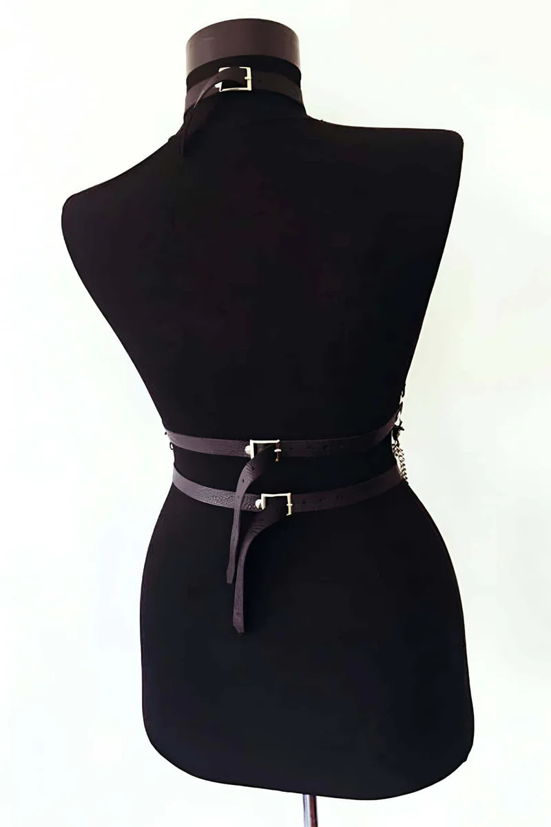 Adjustable straps and buckle detail on black body harness