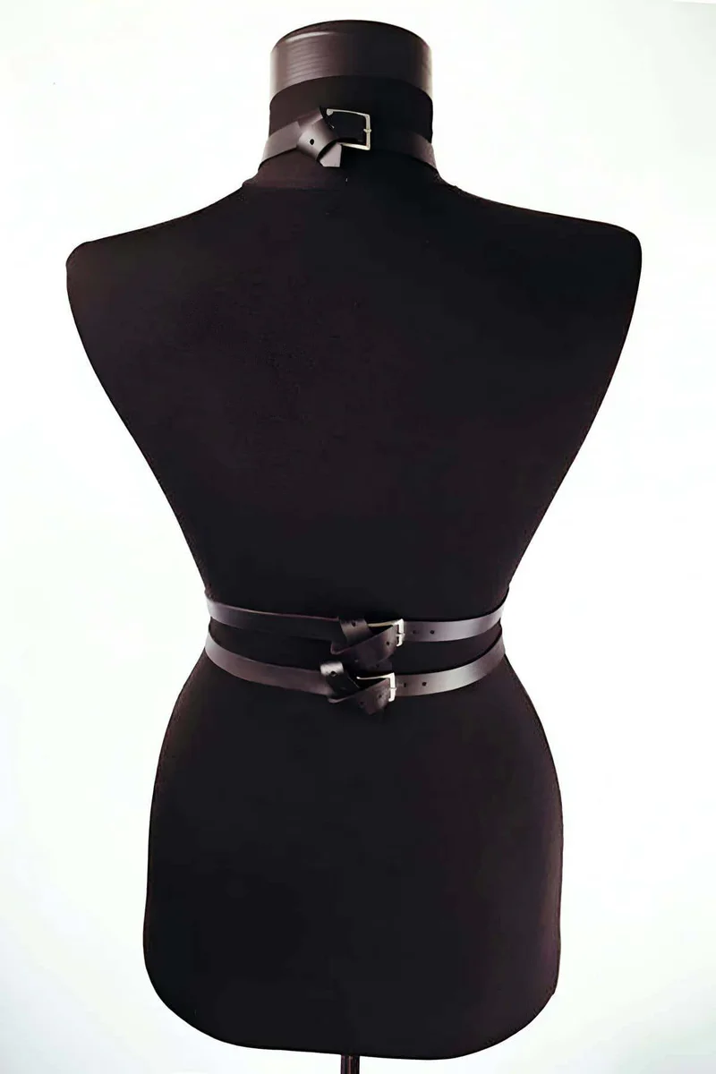 Side profile of black faux leather body harness with double buckled waist belts