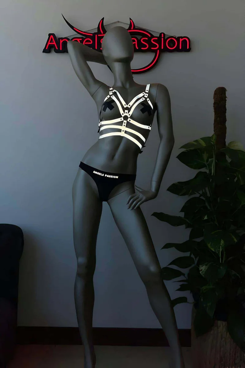 Festival Reflective Harness Set Flat Lay with Blacklight Effect in Silver and Black, featuring chest harness and matching