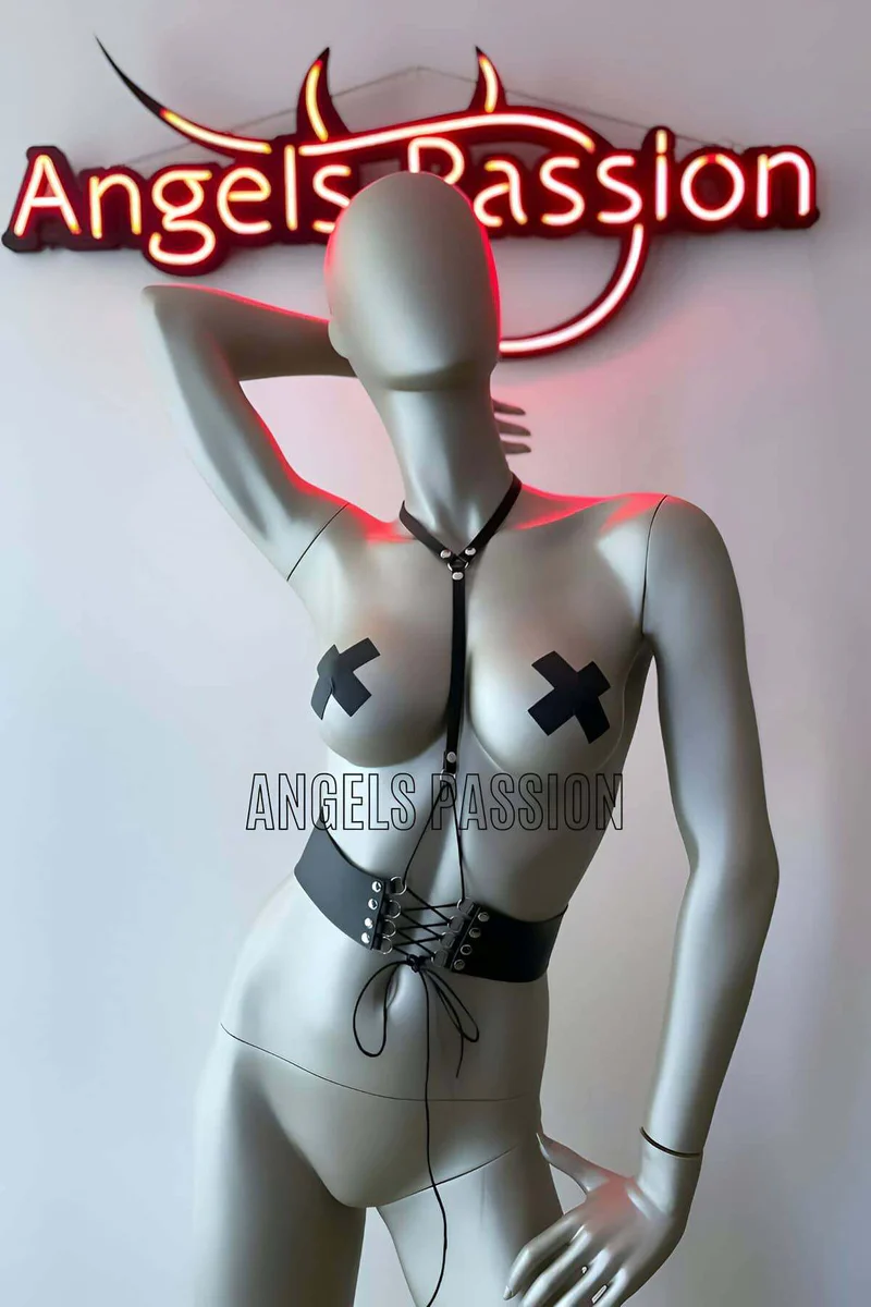 Black vegan leather harness with adjustable chest strap and lace-up detail