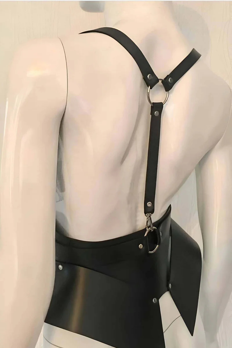 Black faux leather body harness front view with adjustable straps and metal rings