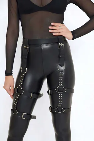 Black Faux Leather Studded Thigh Harness with O-Rings, worn over leggings
