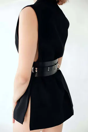 Black Wide Faux Leather Cinch Harness Belt with Silver D-Rings on model
