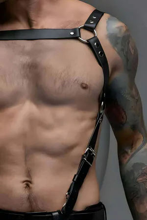 Black Vegan Leather Single Strap Chest Harness with Silver O-Ring on a muscular torso