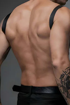 Black Vegan Leather Single Strap Chest Harness with Silver O-Ring on a muscular torso