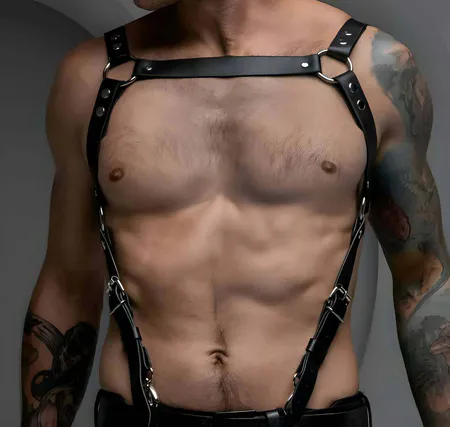 Black Vegan Leather Single Strap Chest Harness with Silver O-Ring on a muscular torso