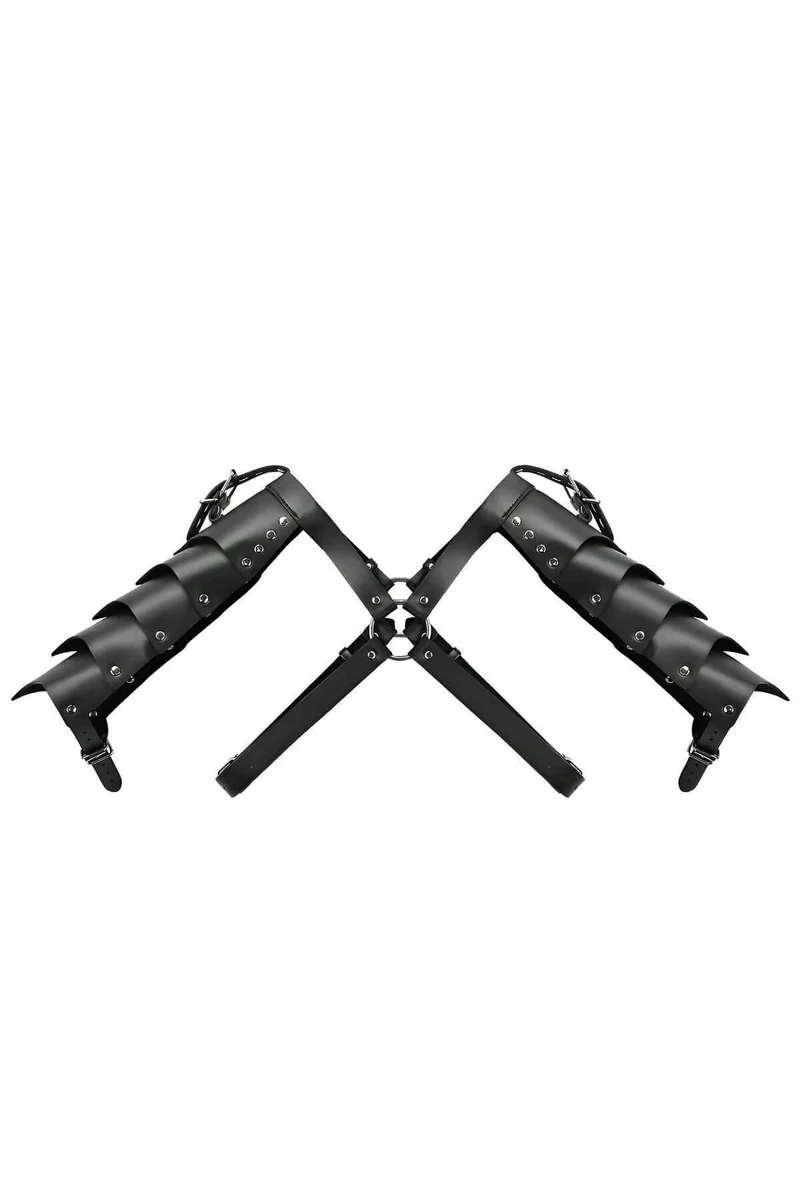 Black faux leather shoulder harness with silver O-ring accents