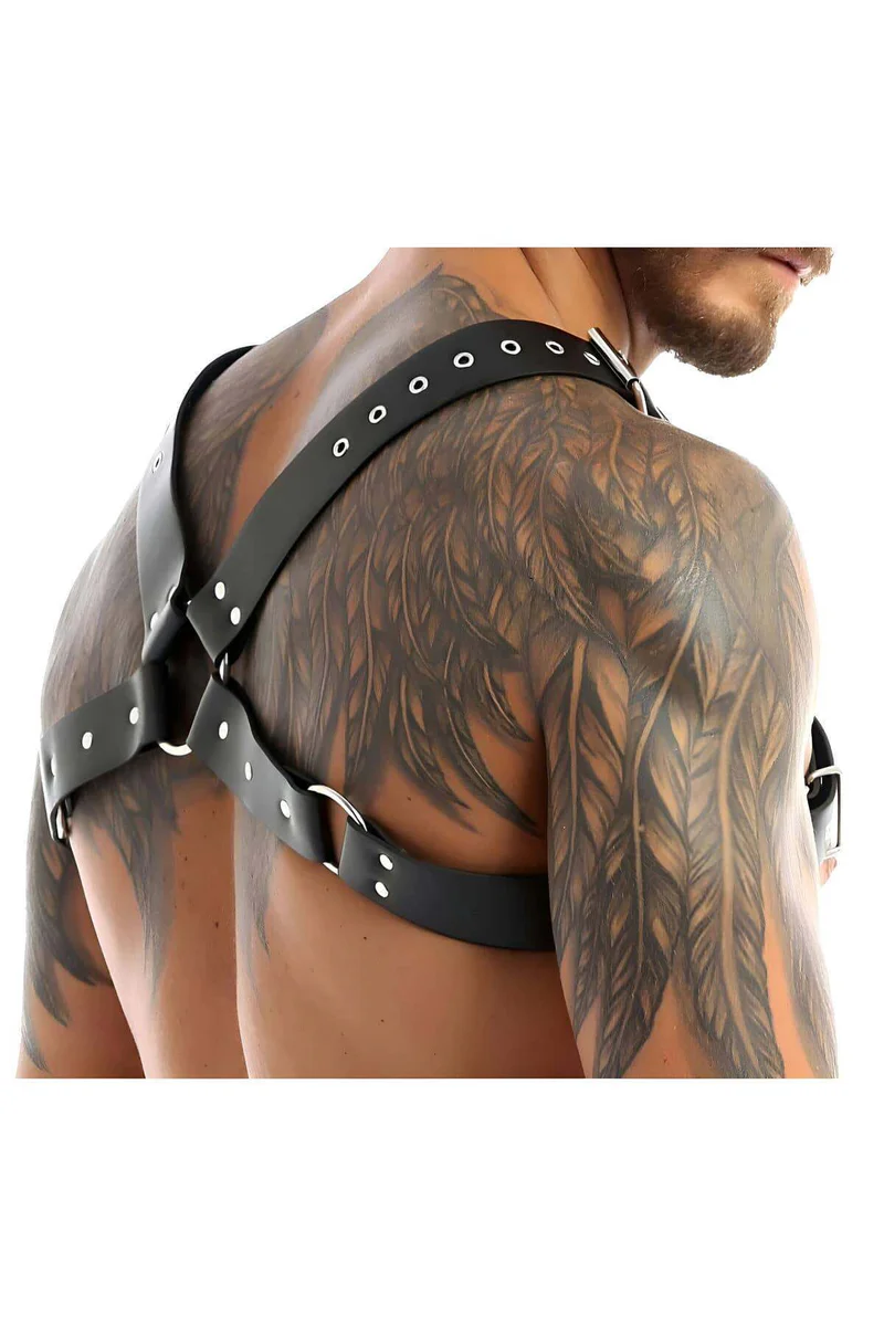 Close-up of black faux leather chest harness buckle detail