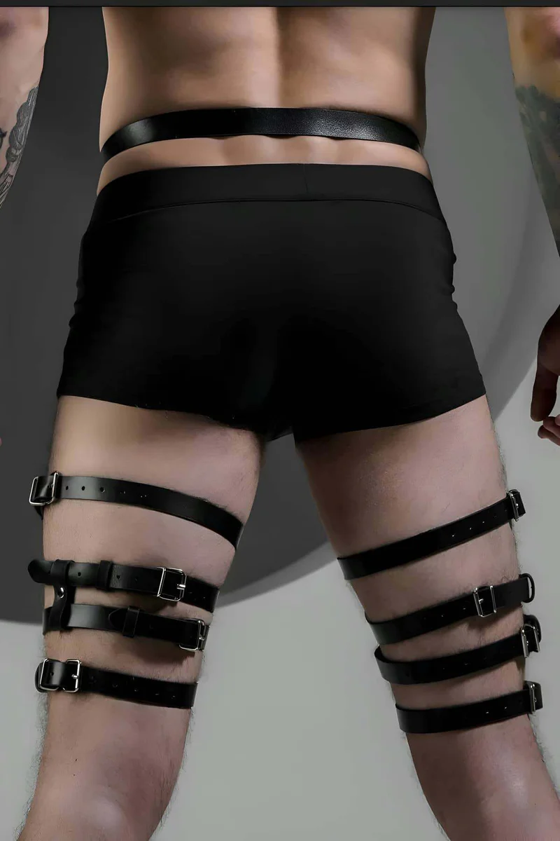 Adjustable black faux leather leg harness front detail with O-rings and buckles