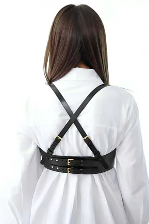 Black Faux Leather Underbust Harness for Women Styled over White Shirt Dress