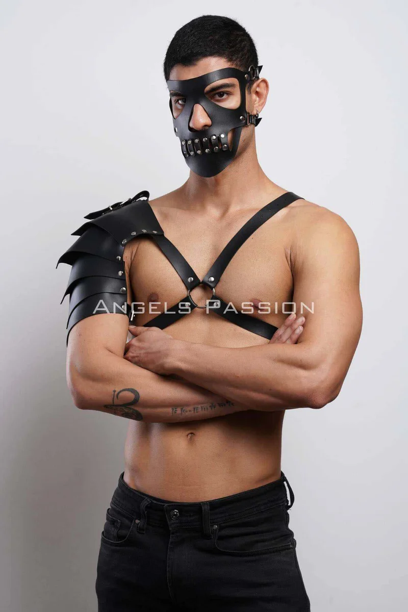 Black studded mask and single shoulder armor harness with silver hardware detail