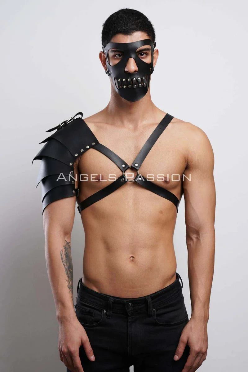 Side view of shoulder armor with layered plating and studded mask.