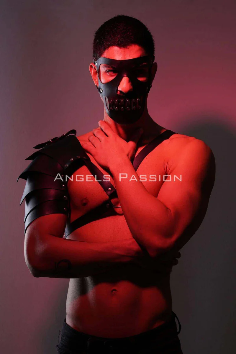 Black studded mask and single shoulder armor harness festival outfit with spiked shoulder detail