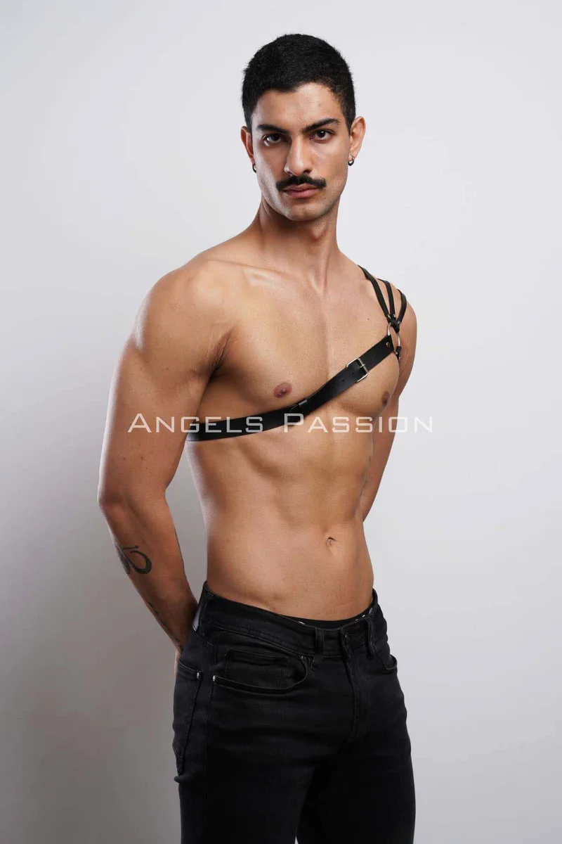 Close-up of O-ring and buckle on black faux leather harness