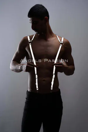 Silver reflective shoulder harness with O-ring detail worn by a person, adjustable straps