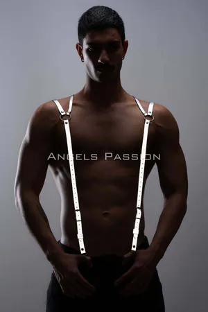 Silver reflective shoulder harness with O-ring detail worn by a person, adjustable straps