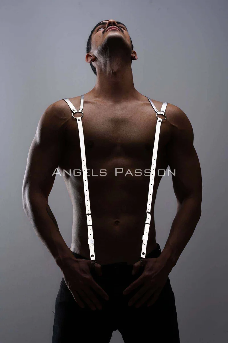 Fashion shot of reflective shoulder harness layered over dark clothing