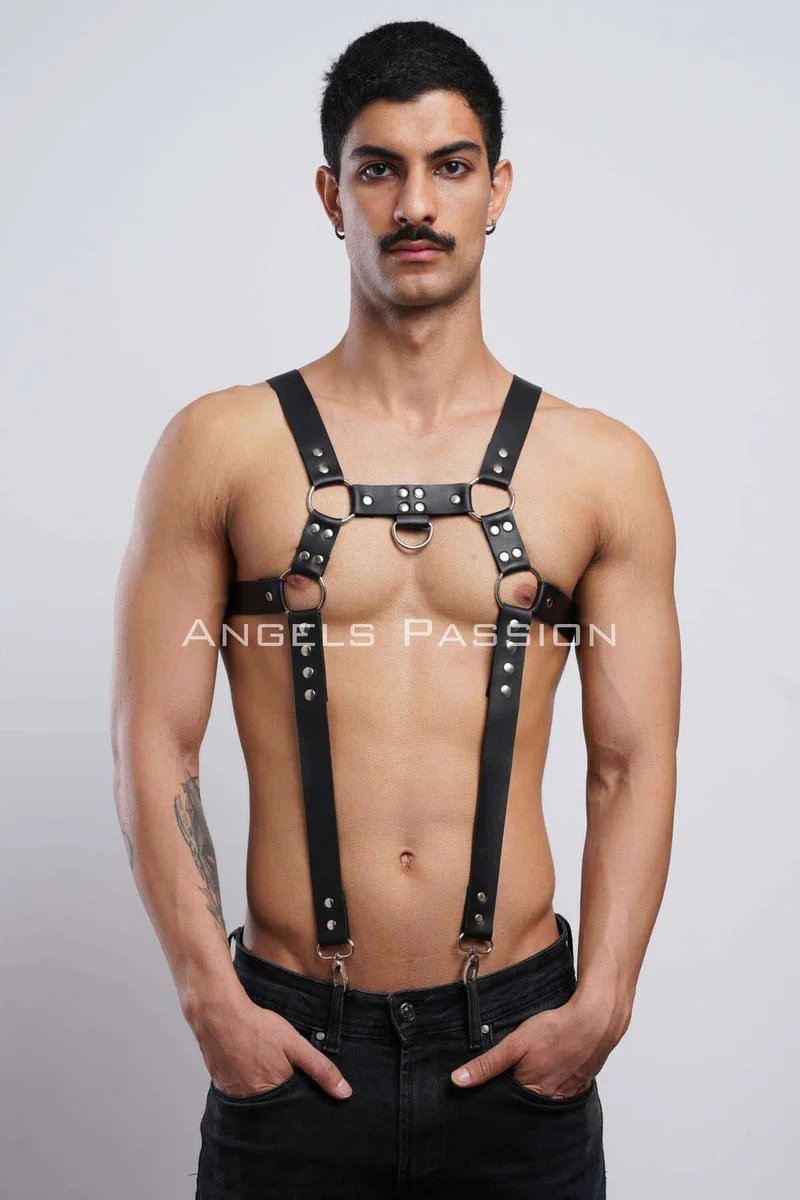 Front view of black faux leather chest harness with central O-ring detail
