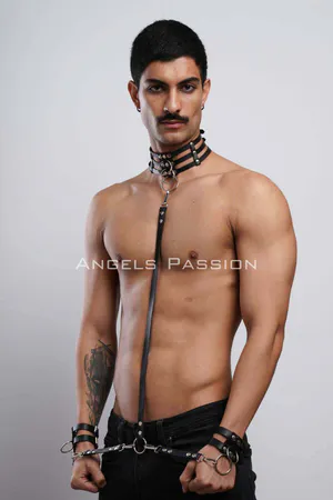 Black Faux Leather Body Harness with Collar and Cuffs, featuring a multi-strap collar with a central O-ring, a vertical body