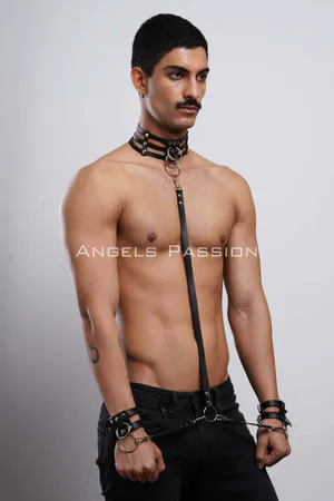 Black Faux Leather Body Harness with Collar and Cuffs, featuring a multi-strap collar with a central O-ring, a vertical body
