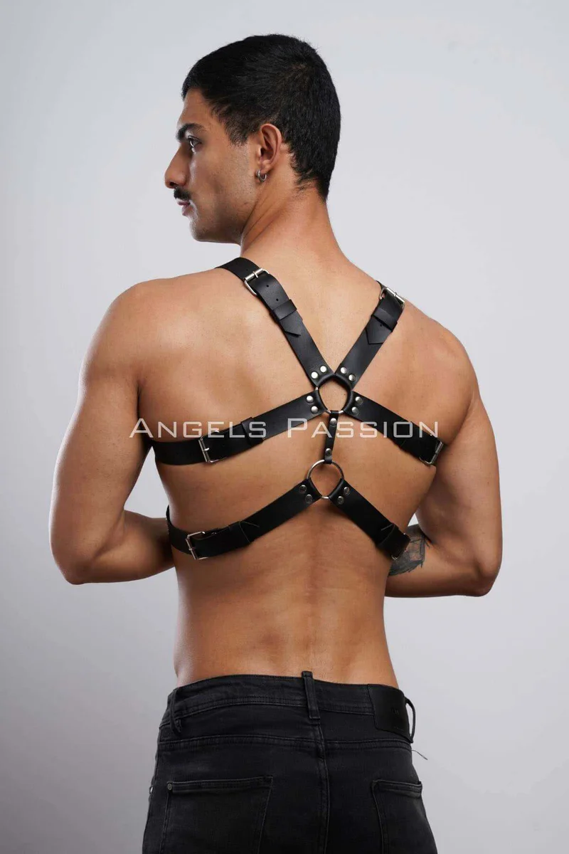 Black faux leather harness chest straps with metal rings