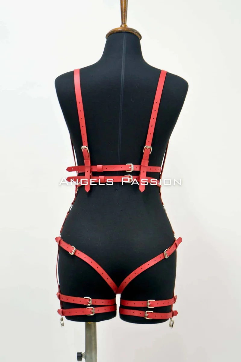 Red faux leather body harness with O-rings back view and leg straps
