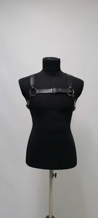 Black Faux Leather Chest Harness with O-Rings and Central Buckle on Mannequin