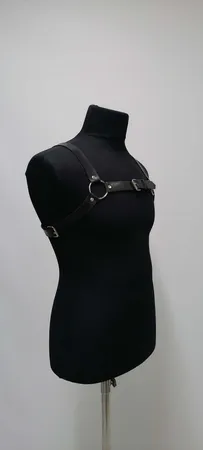 Black Faux Leather Chest Harness with O-Rings and Central Buckle on Mannequin