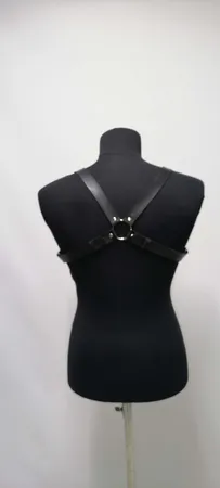 Black Faux Leather Chest Harness with O-Rings and Central Buckle on Mannequin