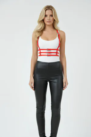 Red Faux Leather Chest Harness with Multiple Buckles Worn Over White Top