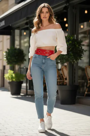Red Faux Leather Wide Waist Belt with Triple Silver O-Rings over a white top and blue jeans