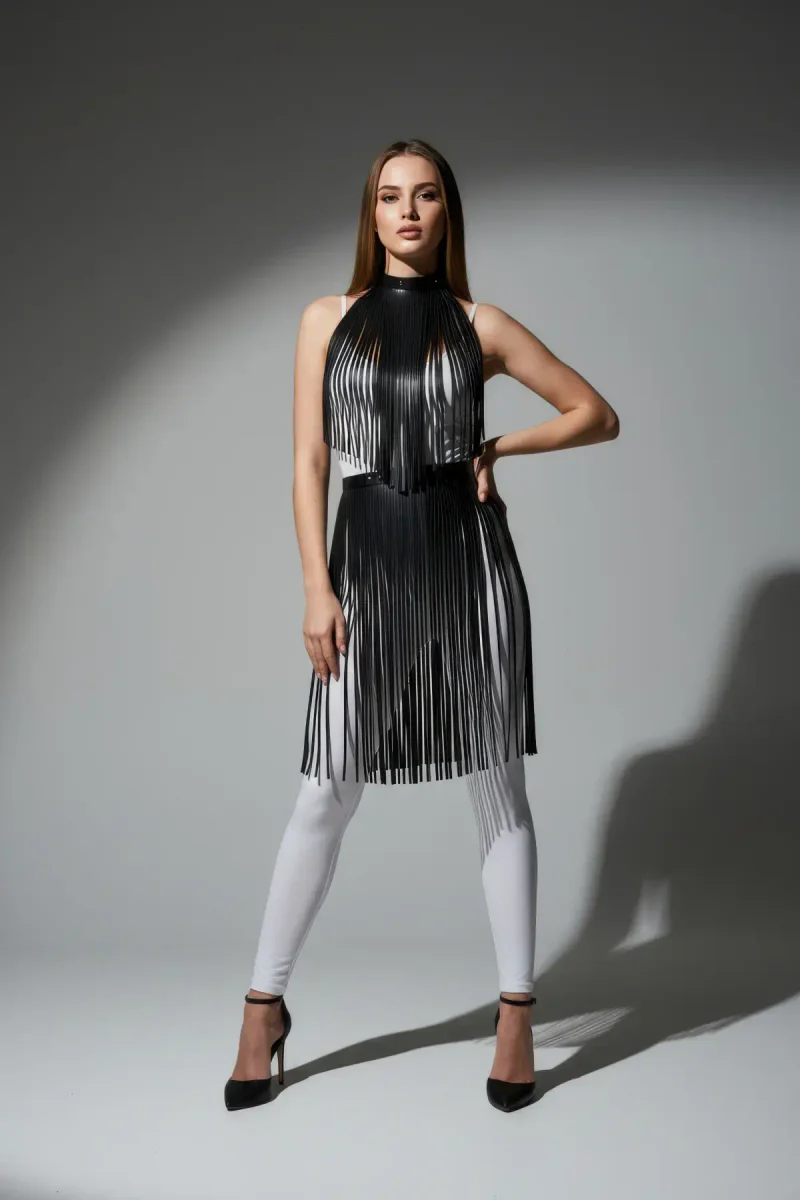 Black faux leather fringe mock neck harness overlay draped on model