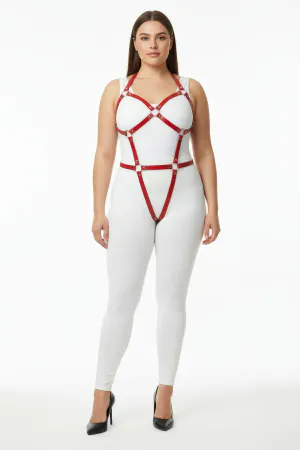 Red vegan leather full body harness with O-ring details on model.