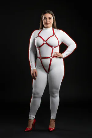 Red vegan leather full body harness with O-ring details on model.
