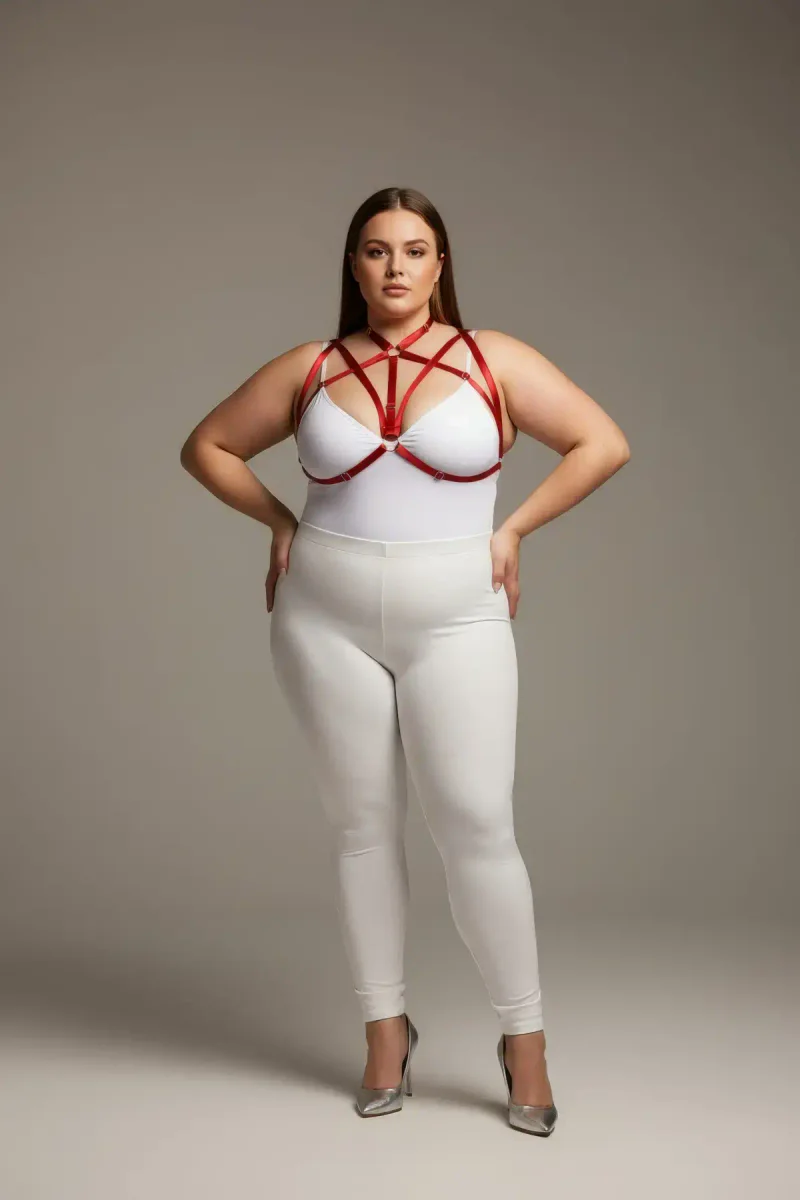 Red strappy chest harness close-up showing O-ring detail
