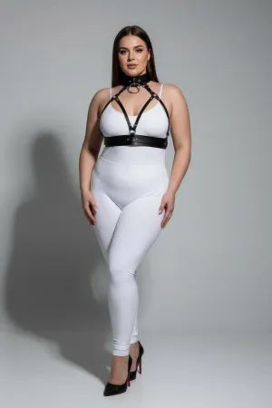Black faux leather choker and chest harness set with O-ring detail on a plus size model